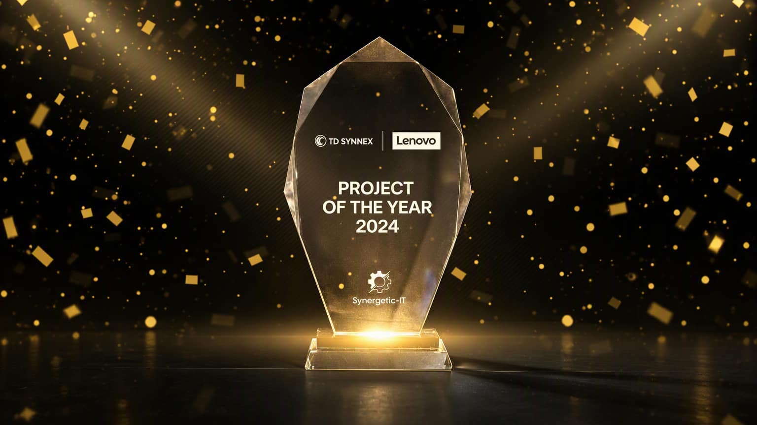 A glowing glass Project of the Year 2024 trophy with the TD SYNNEX, Lenovo and Synergetic IT logos, among golden confetti on a dark background.